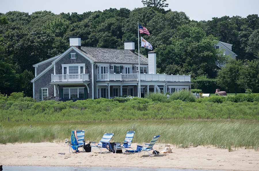 36 Down Harbor Road Edgartown, MA 02539 - Photo 54 of 54 a front view of a house with a yard and lake view
