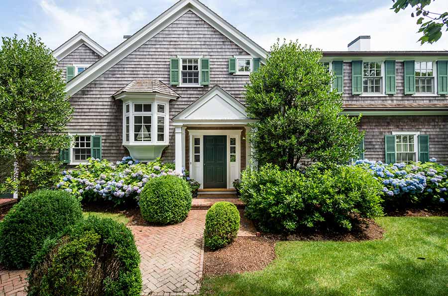 36 Down Harbor Road Edgartown, MA 02539 - Photo 7 of 54 a front view of a house with a yard