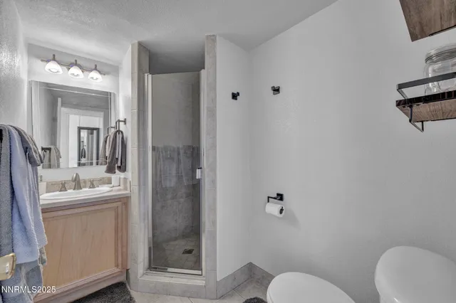 a bathroom with a toilet sink and shower