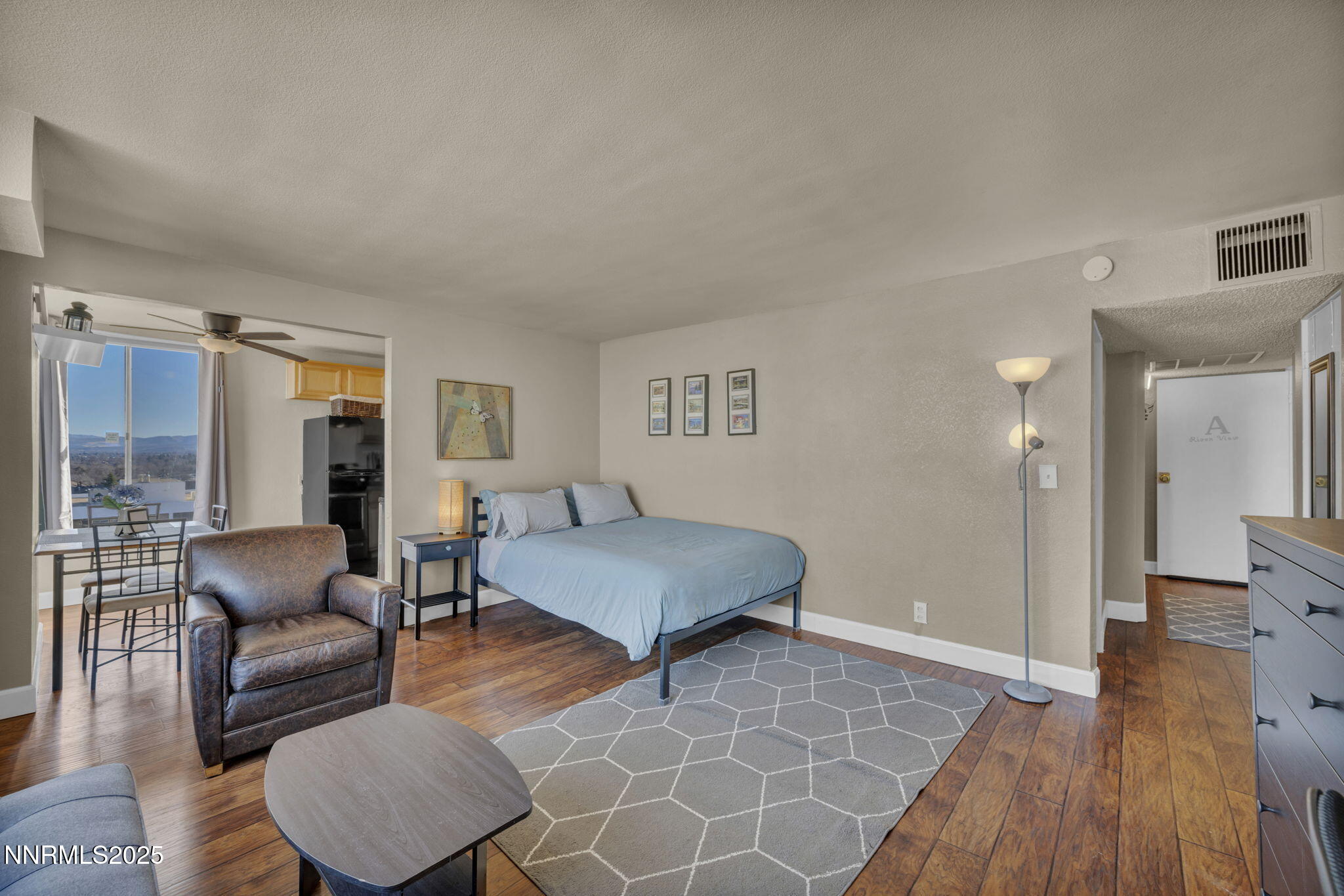280 Island Avenue, Unit 1406 Reno, NV 89501 - Photo 2 of 28 a living room with furniture and a wooden floor