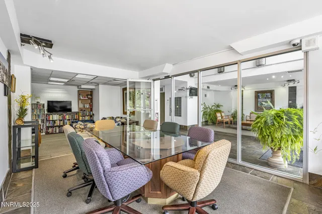 a view of a dining room with furniture window and outside view