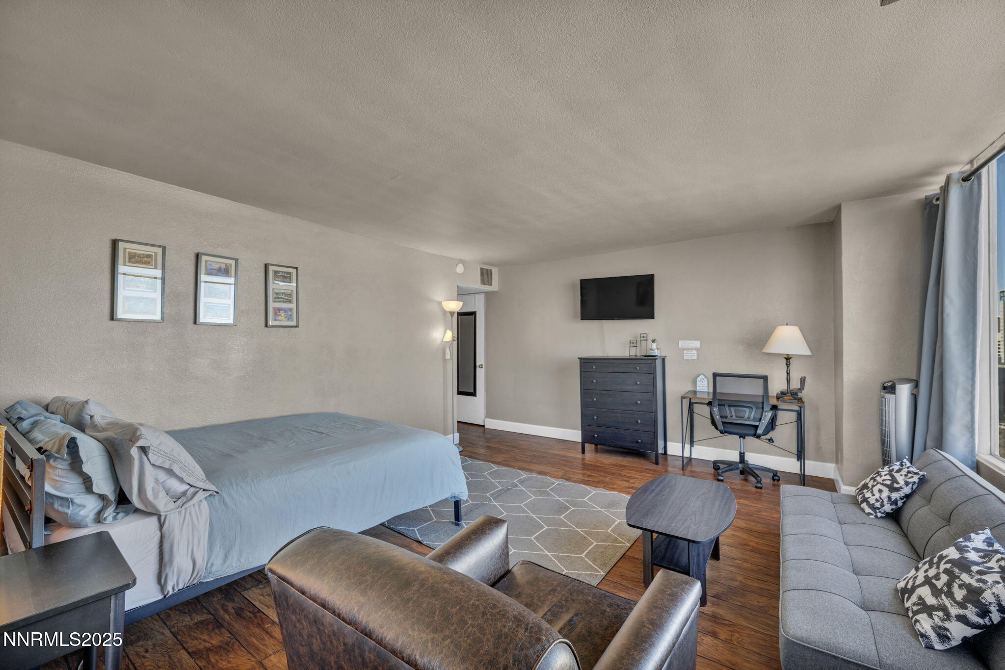 280 Island Avenue, Unit 1406 Reno, NV 89501 - Photo 4 of 28 a living room with furniture and a fireplace