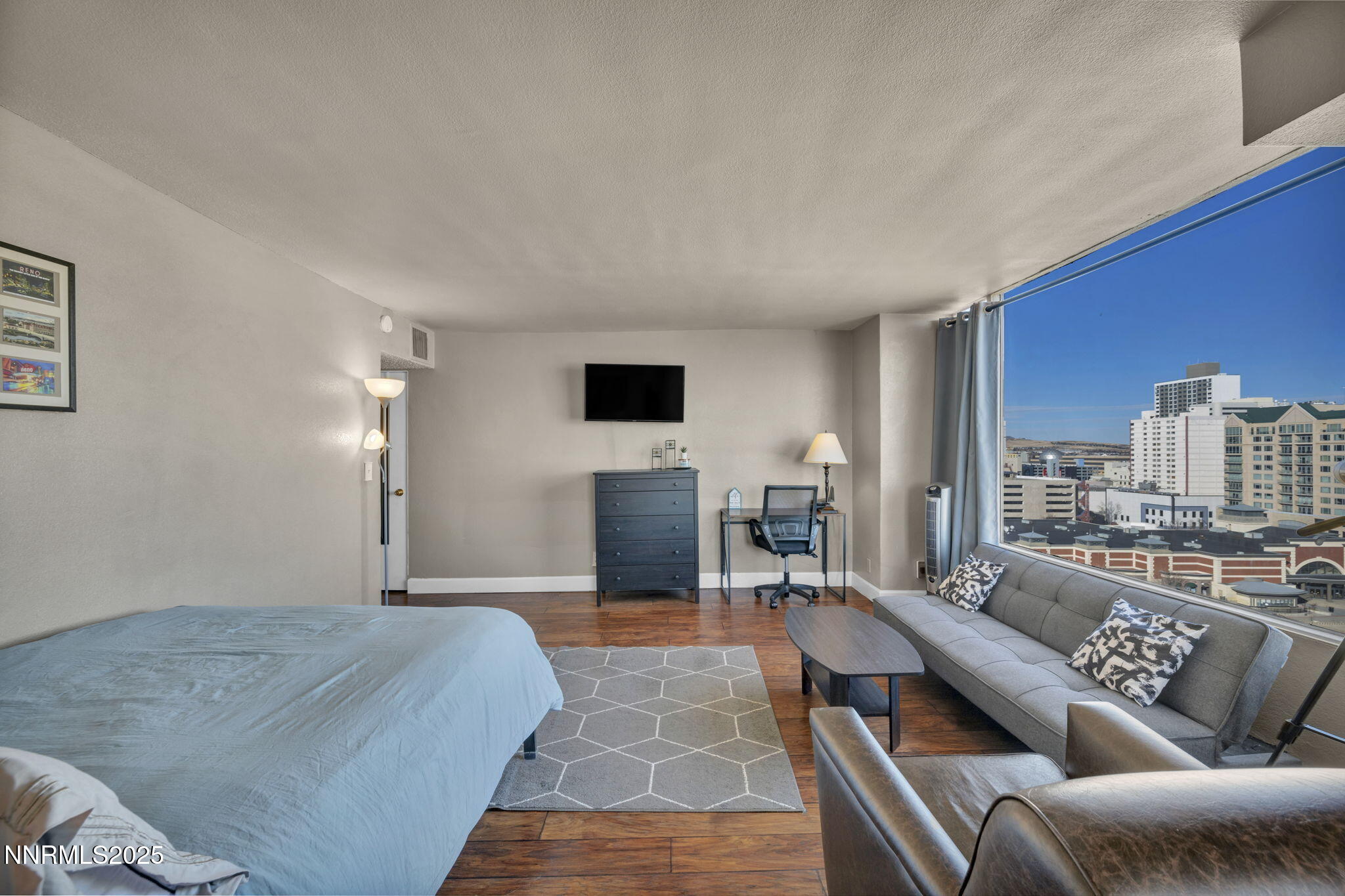 280 Island Avenue, Unit 1406 Reno, NV 89501 - Photo 7 of 28 a living room with furniture and a flat screen tv
