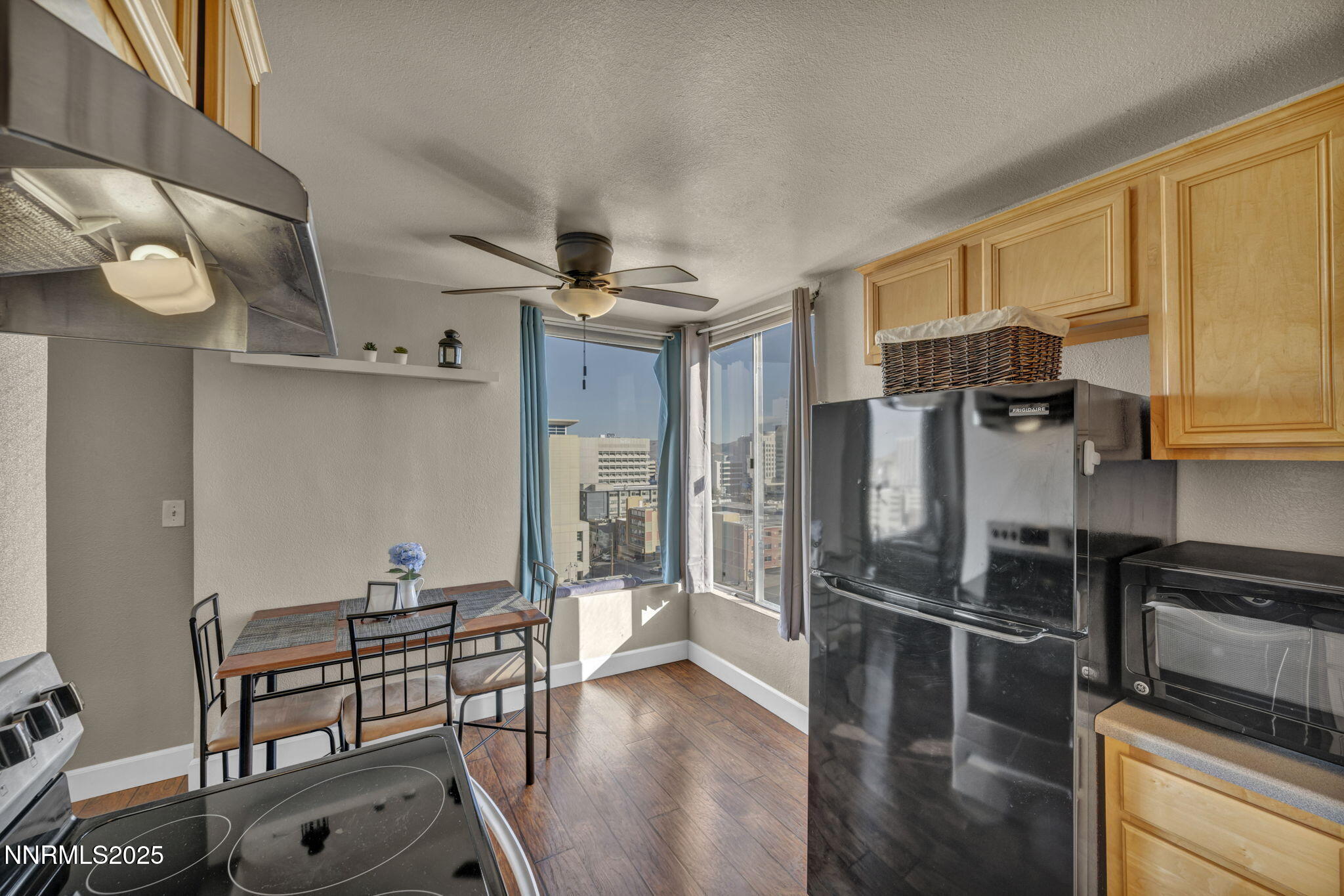 280 Island Avenue, Unit 1406 Reno, NV 89501 - Photo 9 of 28 a kitchen with stainless steel appliances a refrigerator and microwave