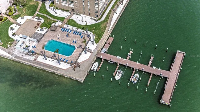 a view of an wooden chairs and a bench in a field