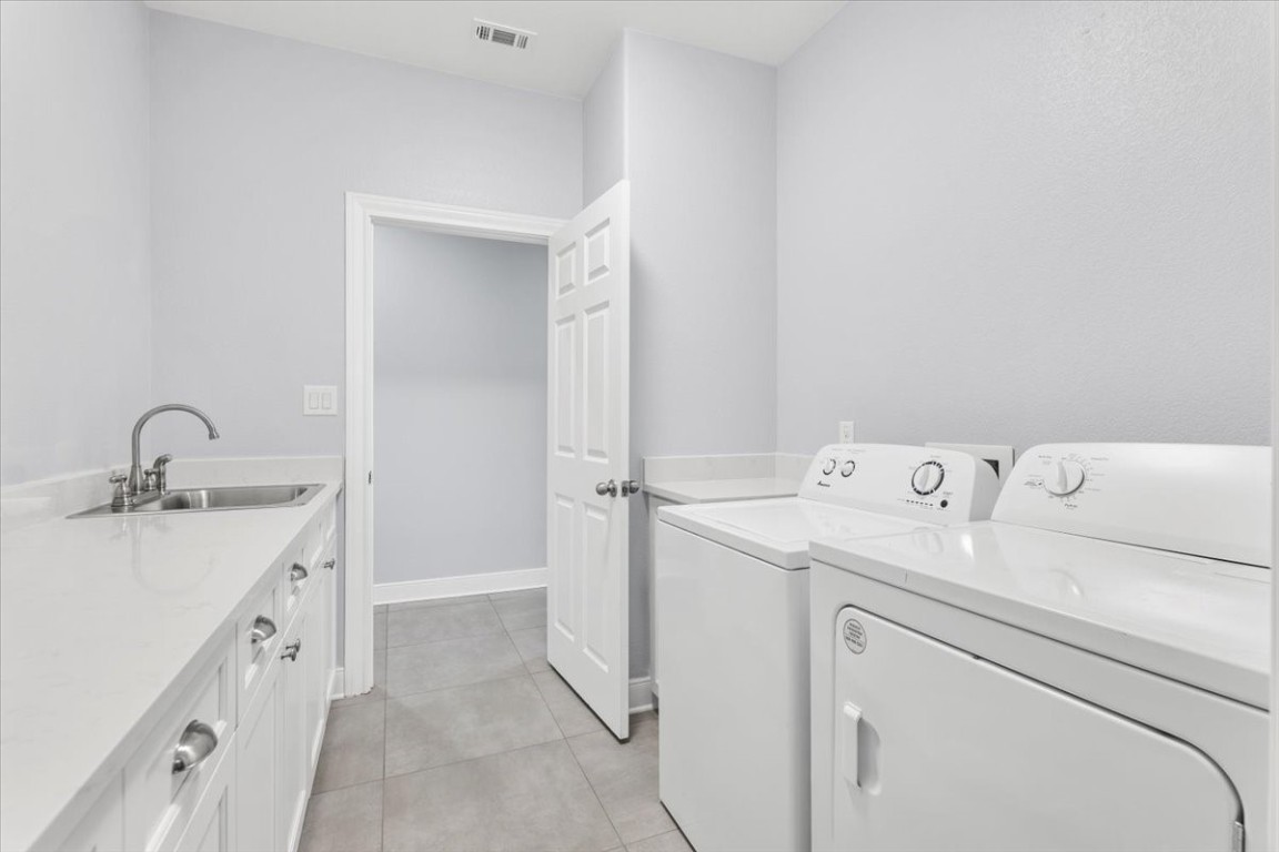 1430 Antioch Road Paige, TX 78659 - Photo 22 of 40 a view of storage and utility room with washer and dryer