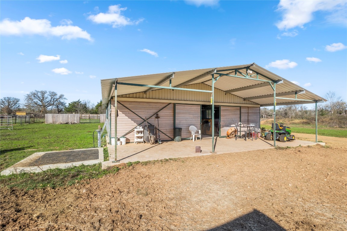 1430 Antioch Road Paige, TX 78659 - Photo 3 of 40 Castlebrook top of the line stables with 5 stalls, 3 stalls have exterior doors