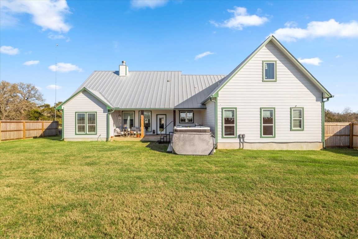 1430 Antioch Road Paige, TX 78659 - Photo 34 of 40 a view of a house with a yard and deck