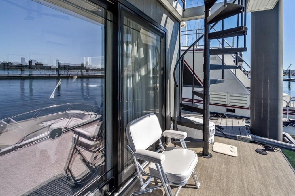 1 Pier 8, Unit BH Boston, MA 02129 - Photo 11 of 18 a view of a balcony dining area and livingroom view