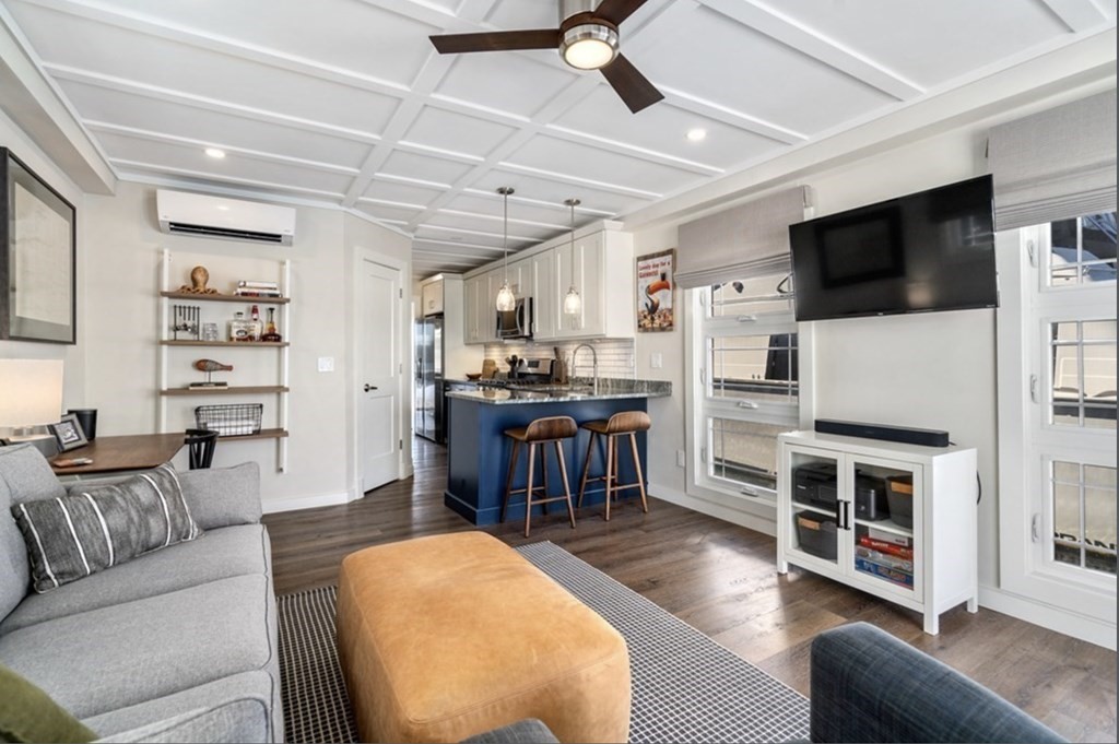 1 Pier 8, Unit BH Boston, MA 02129 - Photo 4 of 18 a living room with furniture and a flat screen tv