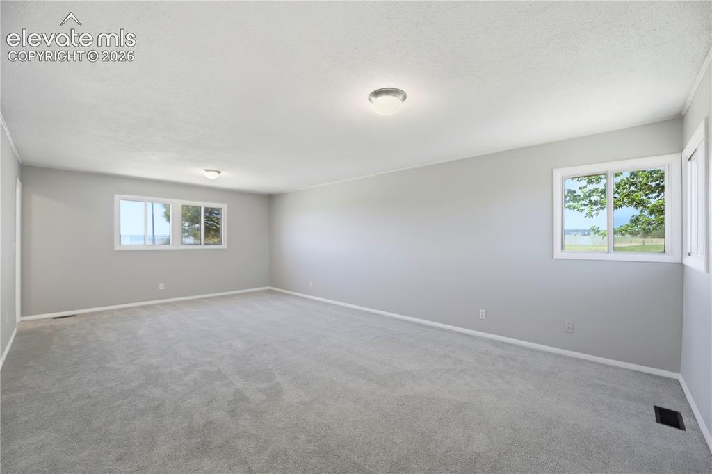 19027 Murphy Road Peyton, CO 80831 - Photo 17 of 48 Carpet, Dual Closets, Primary Bath, Large Room, Windows All Around