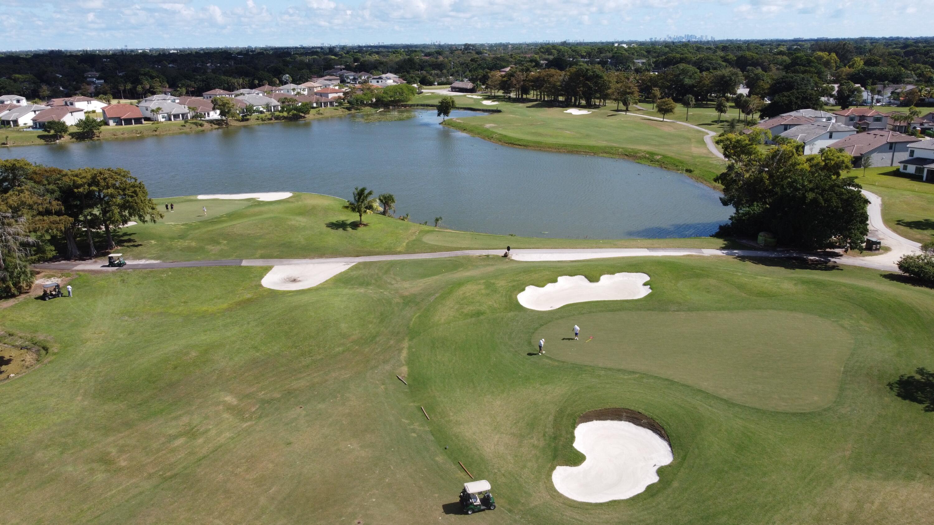 8028 Northwest 78th Street Tamarac, FL 33321 - Photo 30 of 38 a view of a lake with a houses