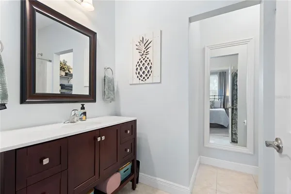 a bathroom with a shower curtain and a toilet