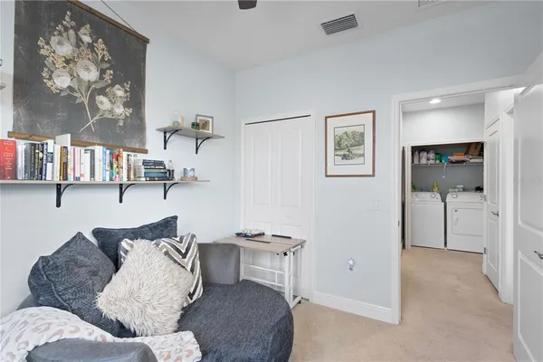 a living room with furniture and a window