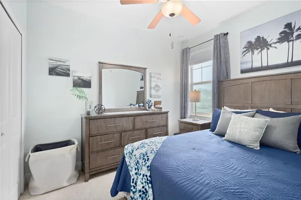 a big room with closet and wooden floor