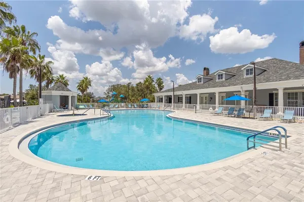 a view of a swimming pool with a patio
