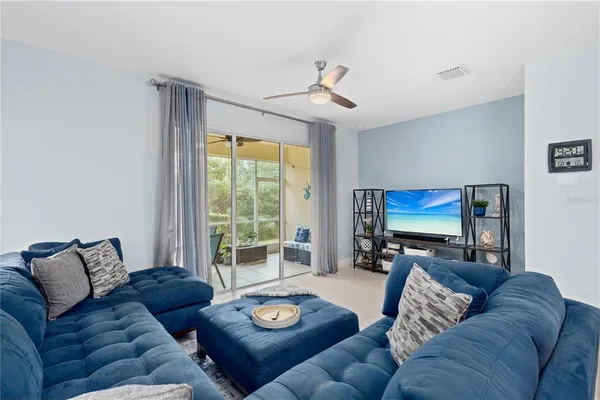 a living room with furniture and a clock