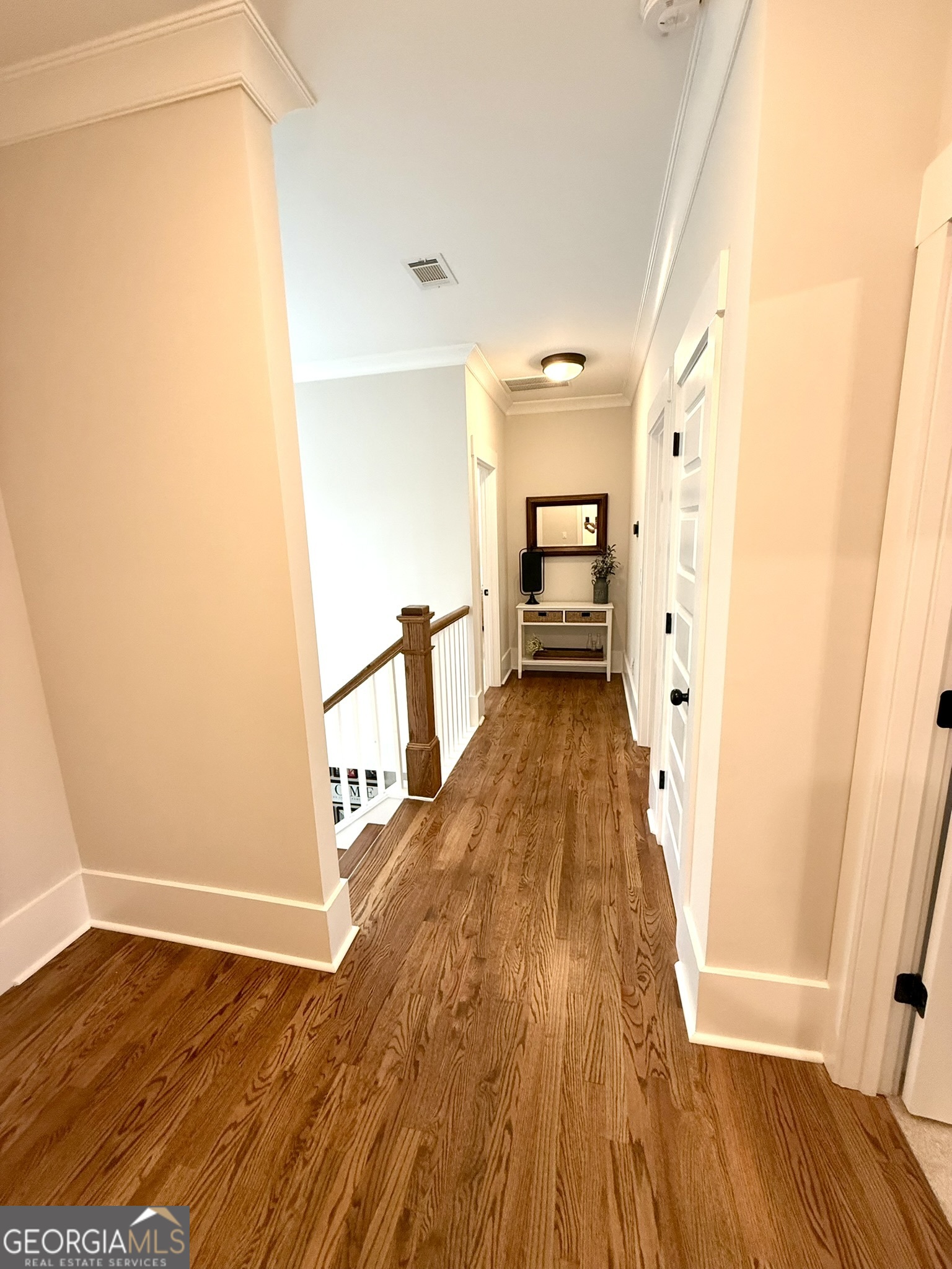 120 Spring Creek Drive Rutledge, GA 30663 - Photo 24 of 38 a view of a hallway with wooden floor