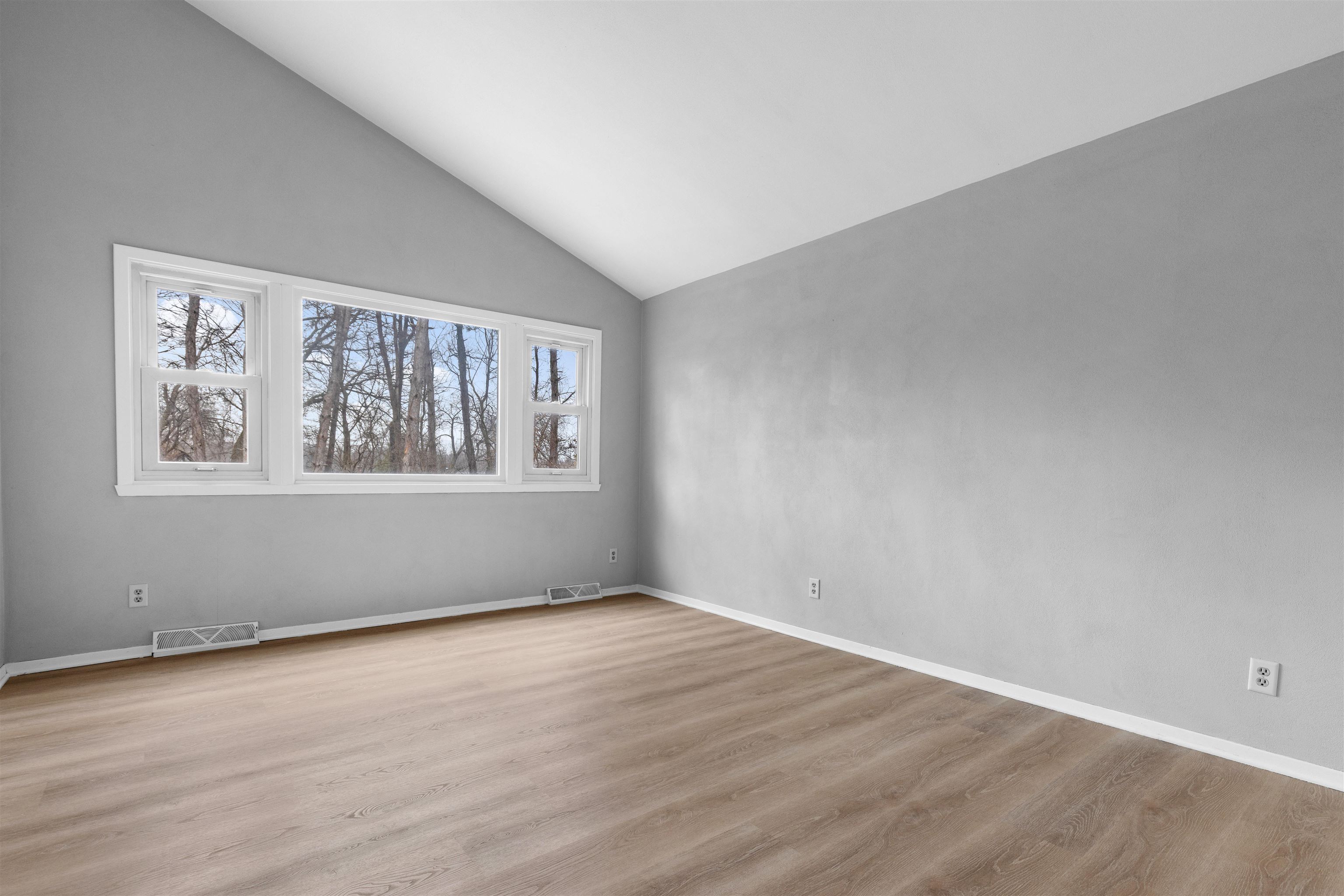 2718 Norway Pine Road Rockford, IL 61109 - Photo 3 of 12 a view of an empty room with wooden floor and a window