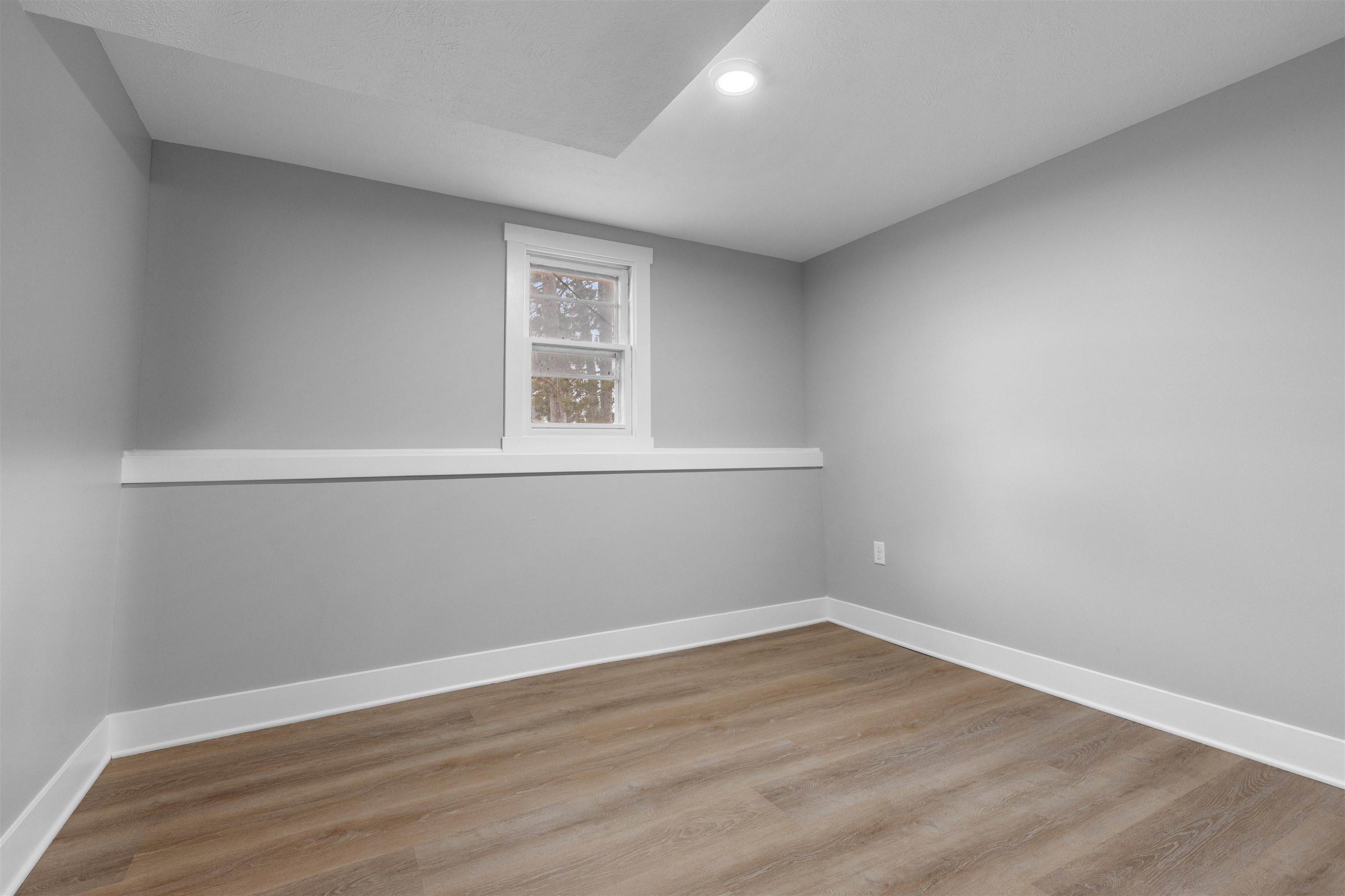 2718 Norway Pine Road Rockford, IL 61109 - Photo 4 of 12 a view of a room that has wooden floor and windows in it