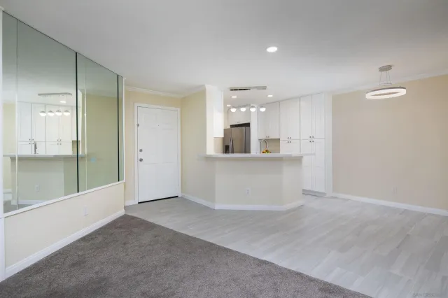 a view of a kitchen with a sink and cabinets