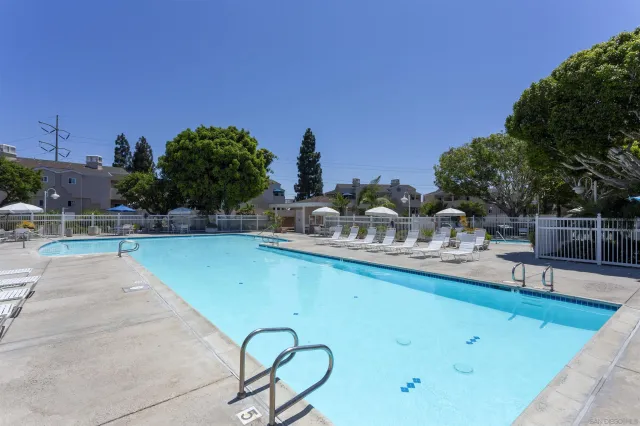 a view of a swimming pool with a lounge chair