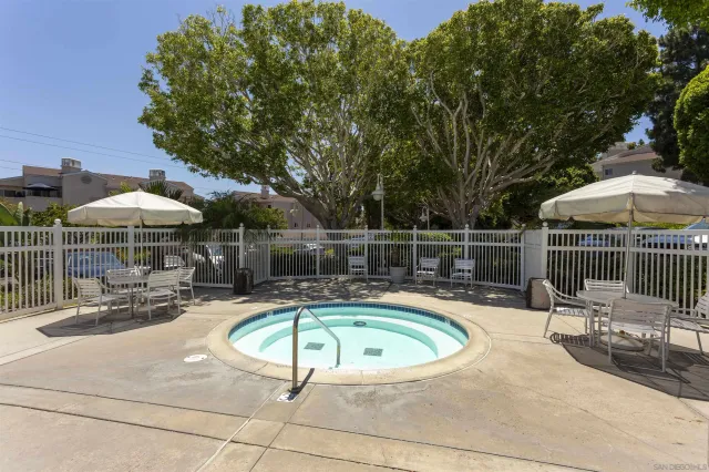 a view of a swimming pool with a patio