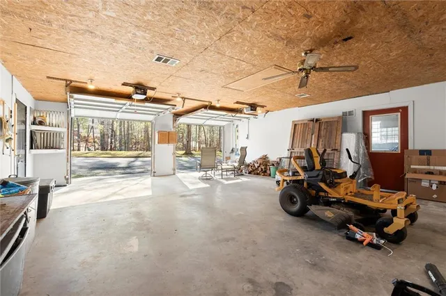 a view of a livingroom with couch and a barbeque