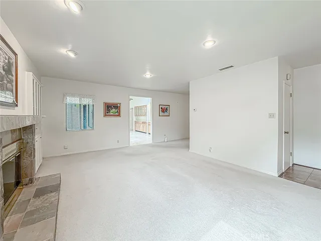 a spacious bathroom with a granite countertop sink and a mirror