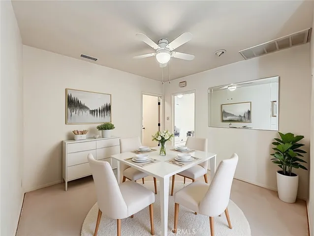 a view of a livingroom with a chandelier fan