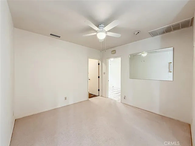 a view of a bathroom with a sink and a mirror
