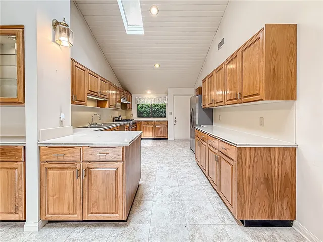 a living room with furniture a table and a mirror