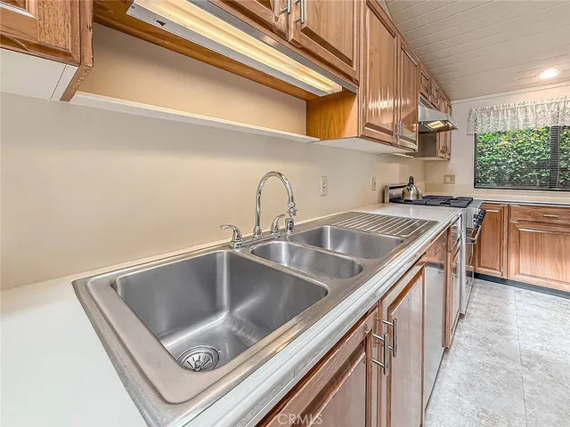 a view of a hallway with wooden floor and entryway