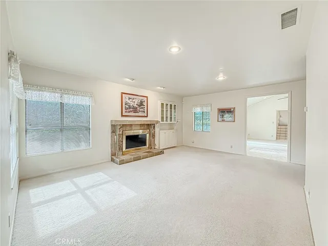 a utility room with cabinets washer and dryer