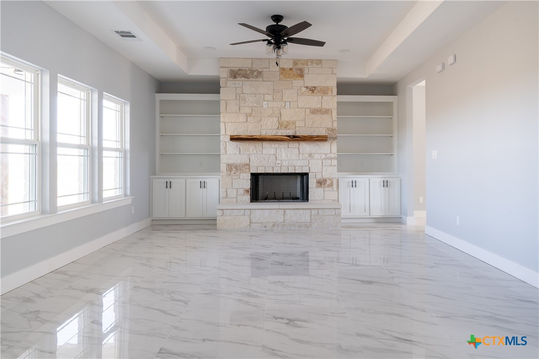 1000 Black Ankle Road Lockhart, TX 78644 - Photo 7 of 40 an empty room with windows and fireplace