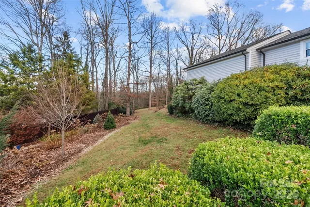 a backyard of a house with lots of green space