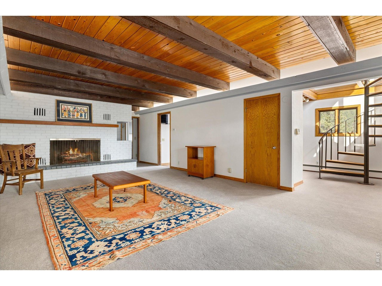 135 Poorman Road Boulder, CO 80302 - Photo 36 of 50 a living room with furniture and a fireplace