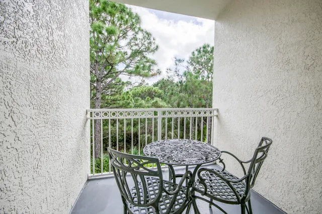 a view of a balcony with furniture