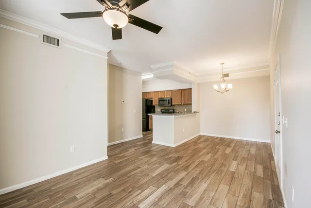 a view of kitchen with sink and wooden floor