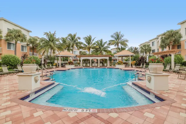 a view of a swimming pool with a patio