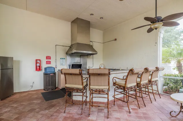 a dining room with furniture and a chandelier