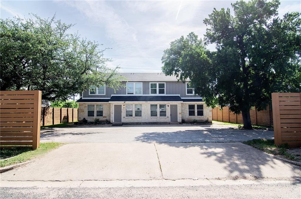 11901 Alpheus Avenue, Unit D Austin, TX 78759 - Photo 1 of 1 front view of a house with a tree in front of it