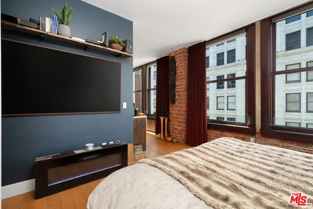 a bedroom with bed and window