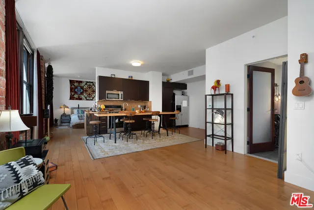 a view of a livingroom with furniture and a flat screen tv