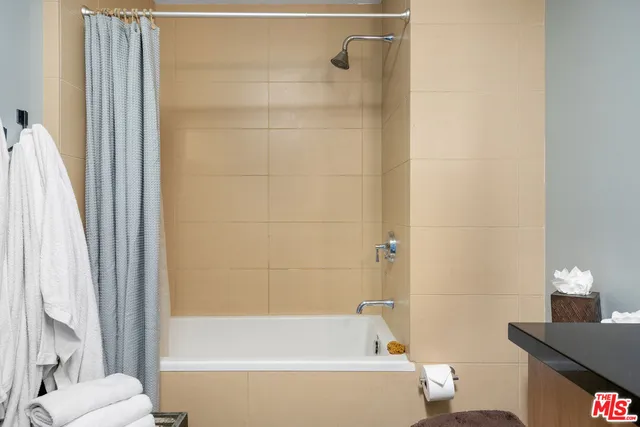 a bathroom with a bathtub and a sink