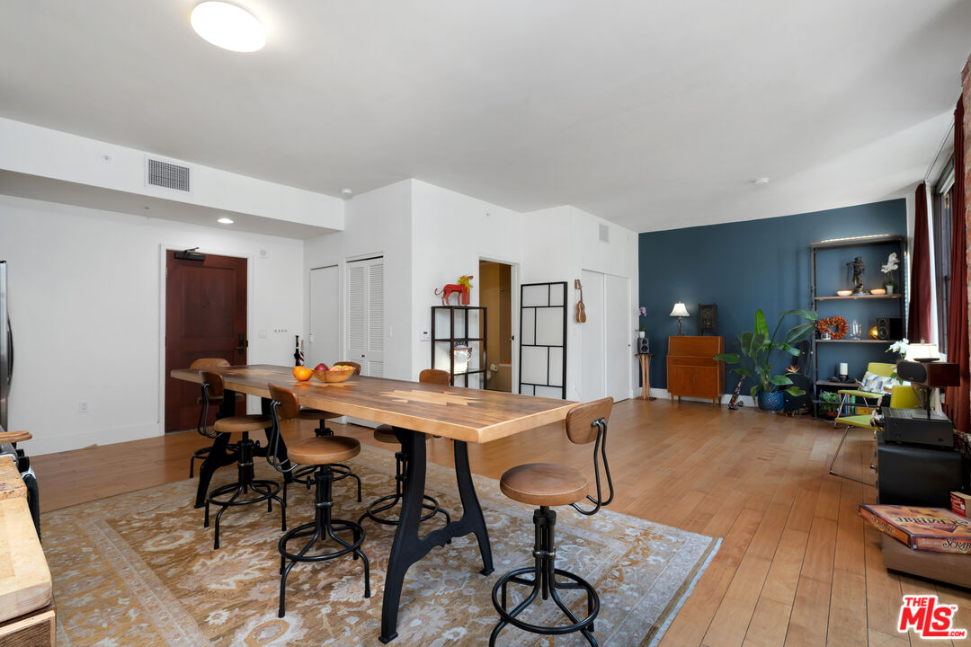 460 South Spring Street, Unit 813 Los Angeles, CA 90013 - Photo 4 of 26 a view of a livingroom with furniture and wooden floor