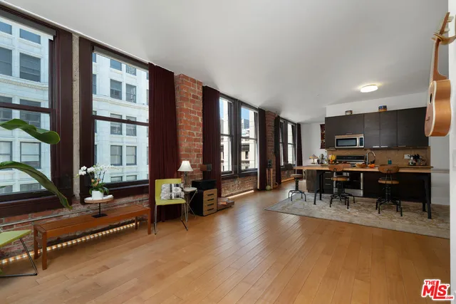 a living room filled with furniture window and a table