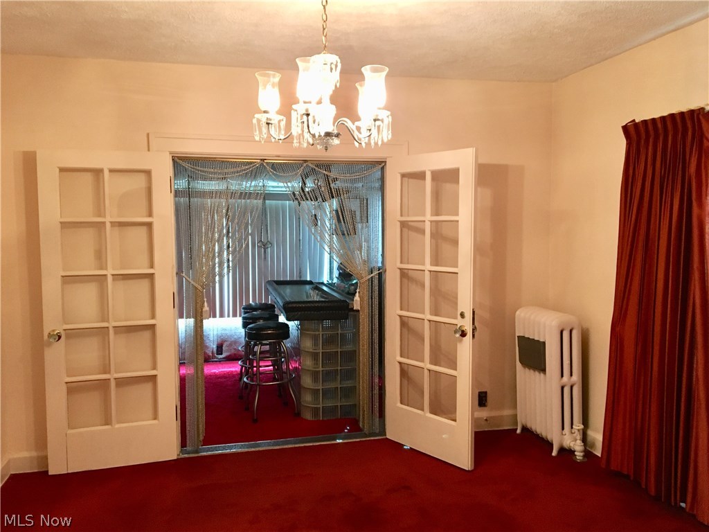 14200 Becket Road Cleveland, OH 44120 - Photo 6 of 10 DINING ROOM LEADING INTO ENTERTAINMENT AREA