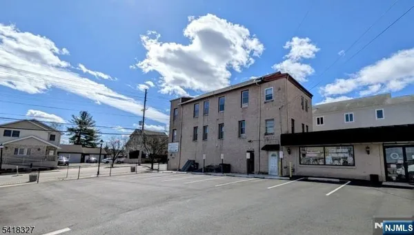 a view of a building with a street