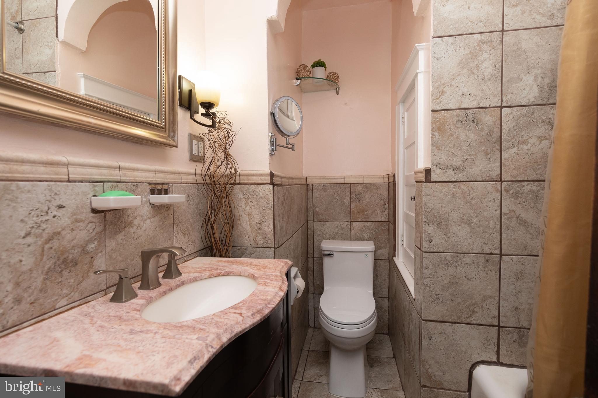 7138 Cottage Street Philadelphia, PA 19135 - Photo 26 of 38 Updated hall bath with laundry chute